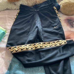 Nike Joggers with Gold Stripe on Sides